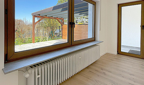 Modernized, light-flooded apartment in a quiet location with garden, XXL terrace & single garage