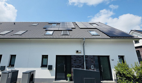 Green family happiness: KFW 40 architect-designed mid-terraced house with PV system and dream garden