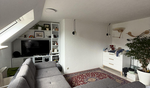 Bright top floor maisonette apartment / 2.5 rooms incl. underground parking space