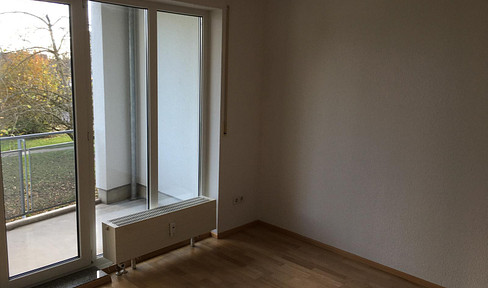 Quiet 2-room apartment with balcony and underground parking