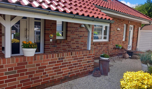 Charming corner bungalow seeks new owners.