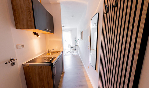 TOP renovated 1-room apartment in Passau - furnished, balcony & water view