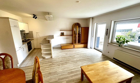 Well-kept 2.5 room apartment in Berkheim with balcony, fitted kitchen and underground parking space