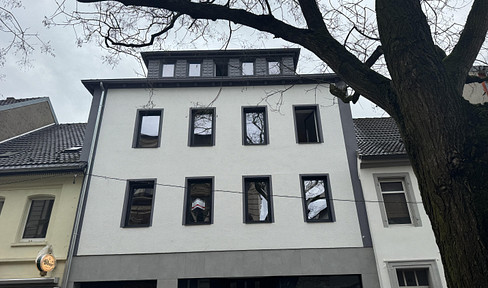 Refurbished residential and commercial building within walking distance of the Rhine