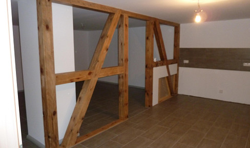 4-room apartment on the ground floor with balcony and garden