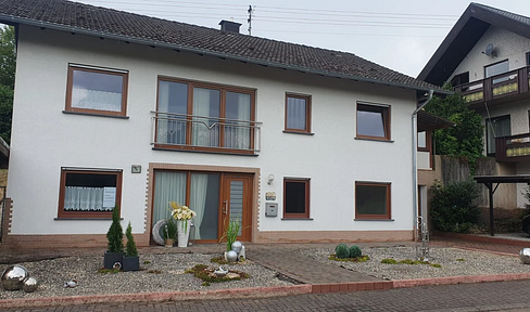 Modern semi-furnished multi-family house with garage and garden