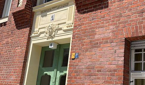 2-Zimmer-Wohnung mit Südwestbalkon im Gartenhaus – Ruhiges Wohnen im roten Backsteinjuwel