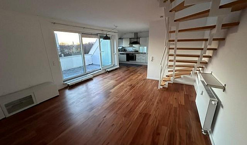 Light-flooded maisonette apartment by the lake