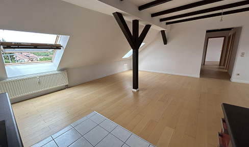 4-room attic apartment with an open-plan living/dining area and a panoramic terrace.