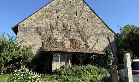 Farm complex in a romantic location on the edge of the village surrounded by gardens and nature