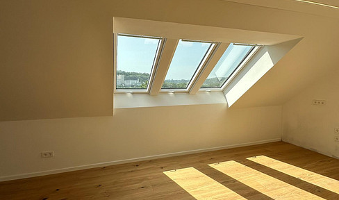 Light-flooded attic apartment in efficiency house 55 - stylish living on 57m²
