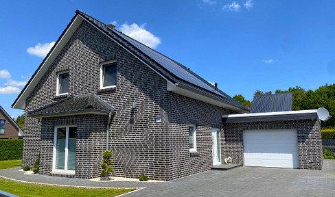 Modern detached house with garage and PV system