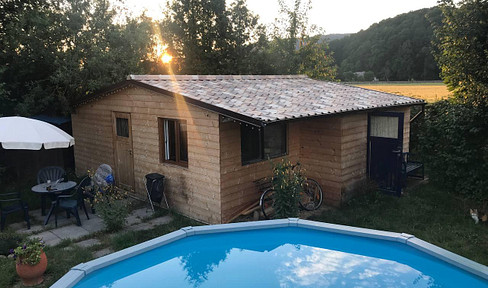 Winter-proof tiny house with large pool for rent on leasehold land in Hainfeld.