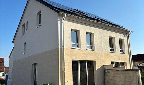 Modern new-build semi-detached house with heat pump and PV system