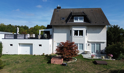 Wohnen & Arbeiten  – Zweifamilienhaus mit  Gewerbefläche