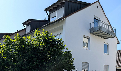 Attractive & sun-drenched 2-room attic apartment with parking space & balcony