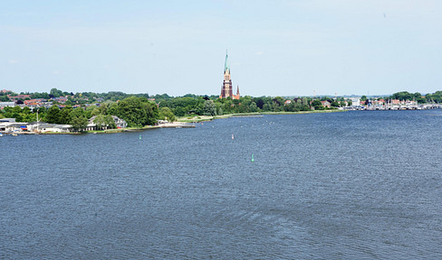Loft apartment with panoramic view of the water in the Wikingturm Schleswig - commission-free!