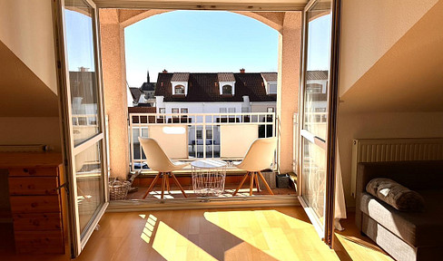 Bright 2-room attic apartment with fitted kitchen and quiet south-facing balcony