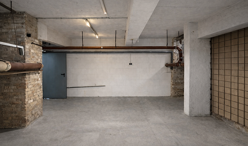 Storage space available for rent in a basement, with a freight elevator.