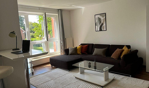 Modern, fully furnished apartment with balcony & underground parking - right on the Hamburg city limits