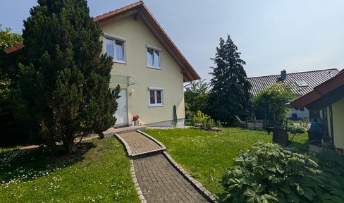 Detached house with double garage and large garden