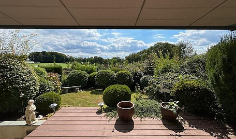 Well-maintained mid-terrace house with garden and unobstructed views of the countryside
