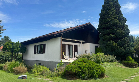 South-west corner plot with well-kept house