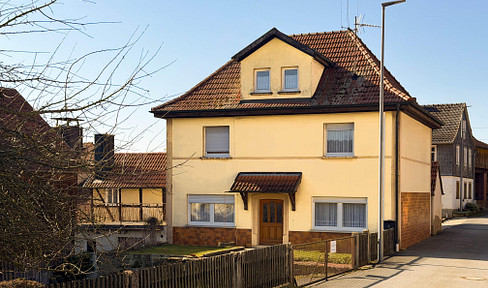 Detached house with a garage, barn, and large garden, located in a beautiful area.