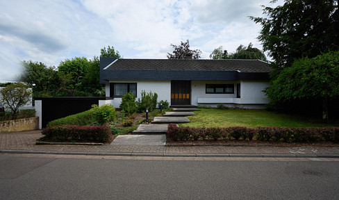 Architect-designed house in a unique location, with a large garden.