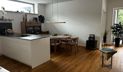 Modern 3-room apartment with outdoor parking space on the green outskirts of the village