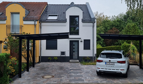 Elegant end terraced house with 4 rooms and 2 carports