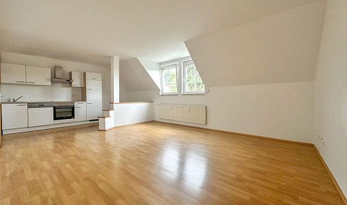 Bright 2-room attic apartment with district heating
