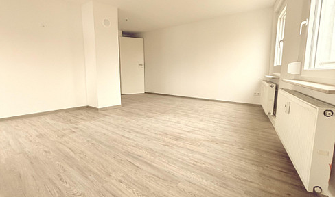 First occupancy after refurbishment - 4.5-room apartment with balcony, garden area, 2 parking spaces