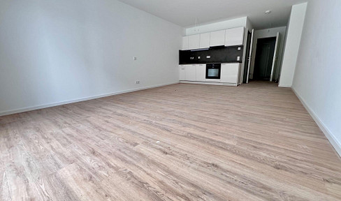 Spacious and modern one-bedroom apartment with a fitted kitchen and balcony, located in a new building.