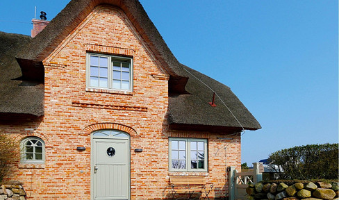 Luxury accommodation with thatched roofs, by the sea.