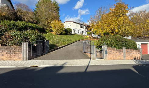 Refurbished two-family house (DHH) with large plot, garage and garden in Obernburg am Main