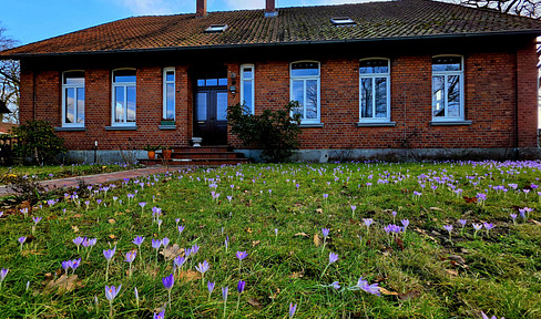 Large detached house in a natural setting.
