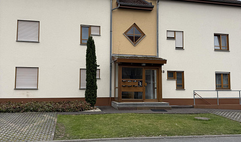 Modern 2-room ground-floor apartment with terrace, parking space, and large basement.