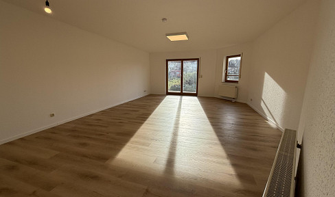 Freshly renovated & modern 2-room ground floor apartment with terrace, parking space & large cellar