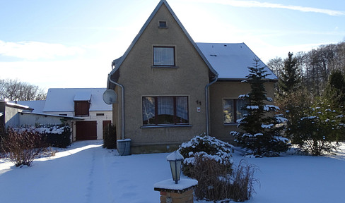 Plot with house for sale