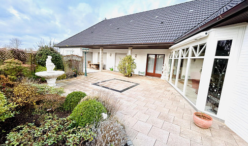VERKAUFT - Stilvoller Winkelbungalow - auf sonnigem Grundstück