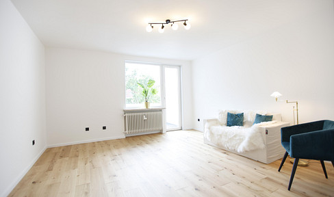 MODERN 2-BEDROOM APARTMENT WITH BALCONY + GARAGE.