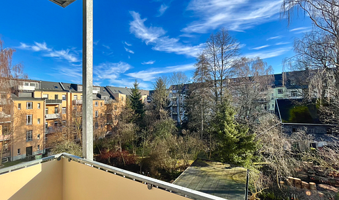 First occupancy - Modern living in a historic district: Features include a modern fitted kitchen, a new bathroom with natural light, a balcony, and an optional parking space.