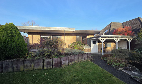 Quietly located bungalow with full basement, large garage and garden shed