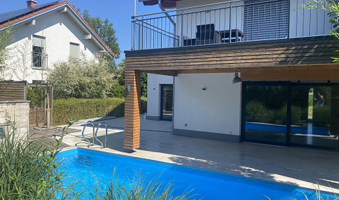 Exclusive garden apartment with a pool, offering the features of a detached house, in the Chiemgau region – 155 m², maisonette style, KfW A+ energy efficiency rating.