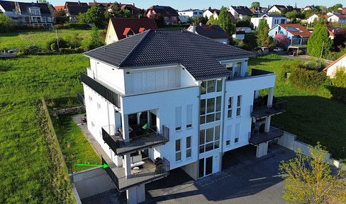 Neubau in Feldrandlage: 3-Zimmer-Wohnung mit Gartenzugang von allen Räumen mit Abendsonne & Ausblick