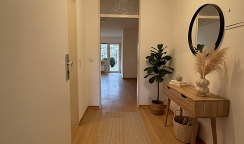 3-Zimmer-Wohnung mit Terrasse, kleinem Garten und offenem Wohn-Essbereich im Untergeschoss