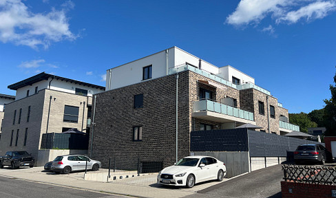 Exclusive 2-room apartment with underground parking, heat pump, and wall-mounted charging station for electric vehicles.