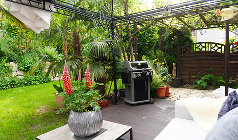 Terraced house with a double garage, solar panel system, and storage space.