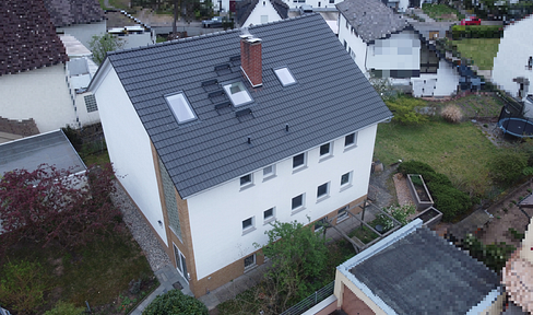 Multi-family house with three 3-room apartments, large garden, and a quiet, prime location.